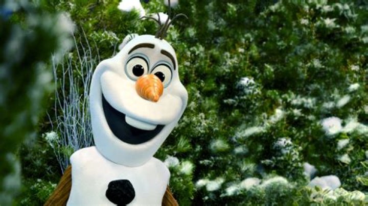 Olaf smiling in front of fire, leaves, and snowflakes for Frozen 2