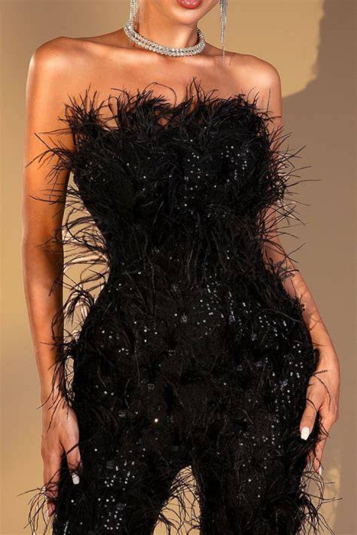 One-shoulder bandage jumpsuit with feather and mesh detail