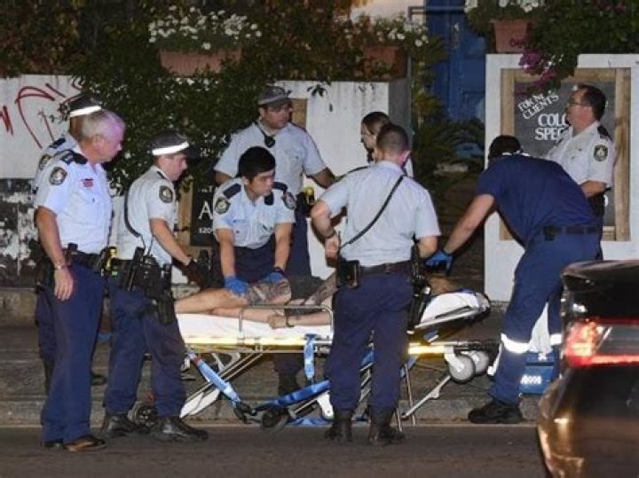 Paramedics take Amati away from the scene and off to hospital. Photo / News Corp Australia 