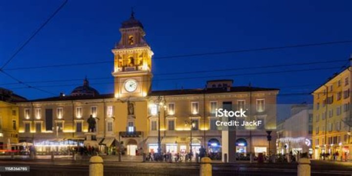 Parma City Hall Illuminated at Dusk and Monument Editorial Image