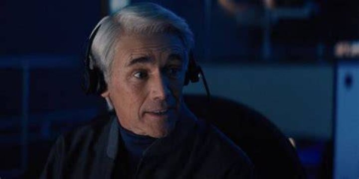 Peter Isherwell wearing a headset in Don't Look Up
