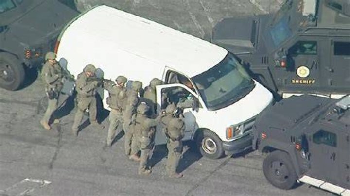Police surround the suspect&rsquo;s van in Los Angeles after a mass shooting that killed 10 people in Monterey Park. Photo / KABC