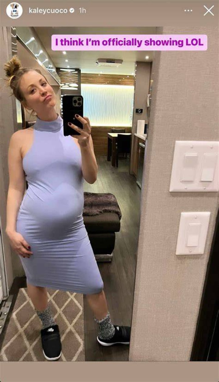 Pregnant Kaley Cuoco exposes her bare baby bump in revealing shirt with