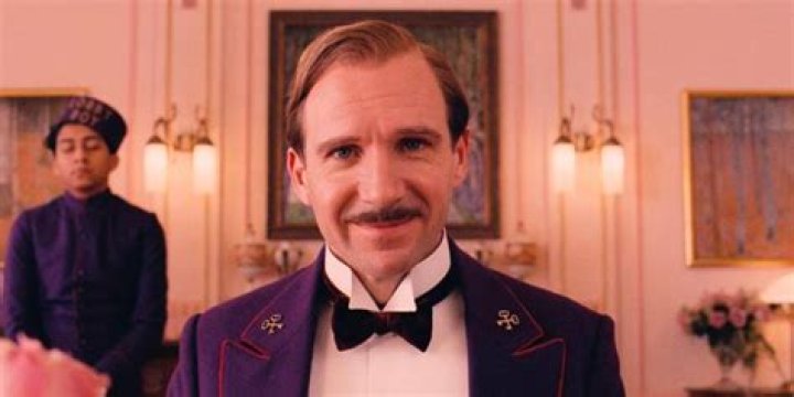 Ralph Fiennes in a purple suit in The Grand Budapest Hotel