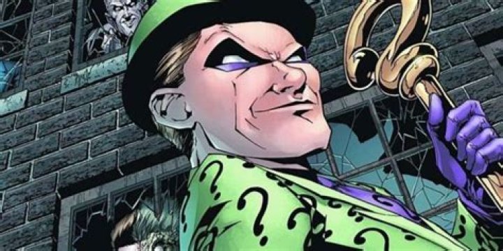 Riddler holding his cane in the comics
