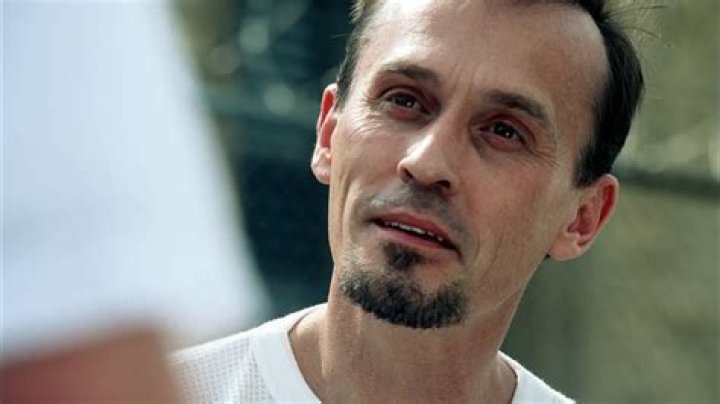 Robert Knepper as T-Bag looking out of a window in Prison Break
