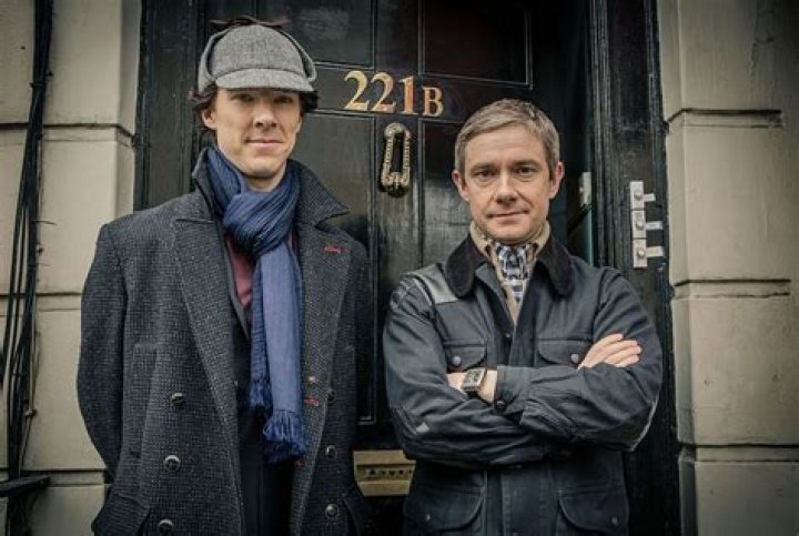 Sherlock Holmes and Watson in front of their home.