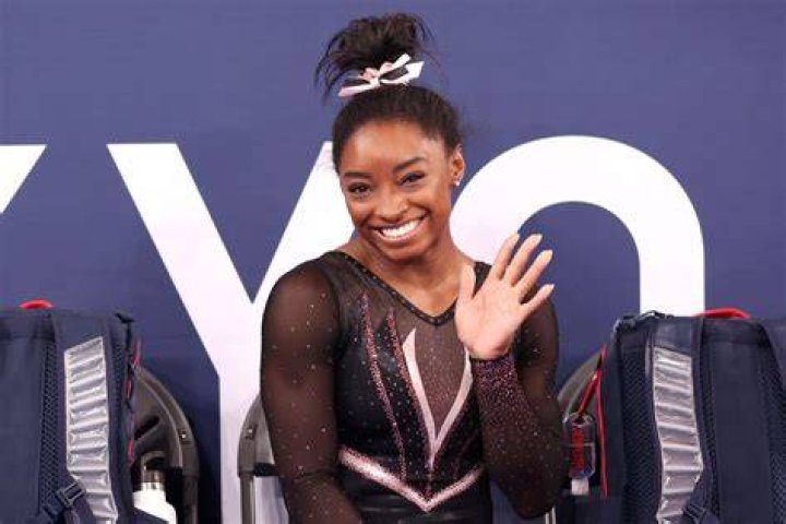 Simone Biles waving 