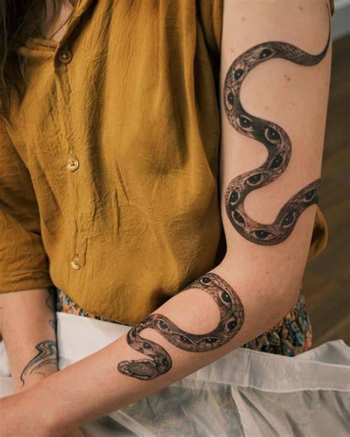 Snake wrapping the arm tattoo YouTube