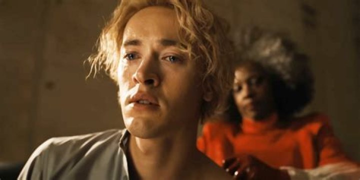Snow (Tom Blyth) is crying as Dr. Gaul (Viola Davis) sews up his back in Ballad of Songbirds and Snakes