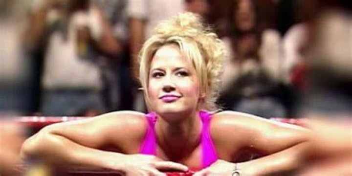 Sunny leaning on ropes in WWE