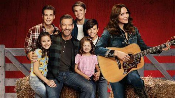 The cast of Country Comfort pose for a promo image
