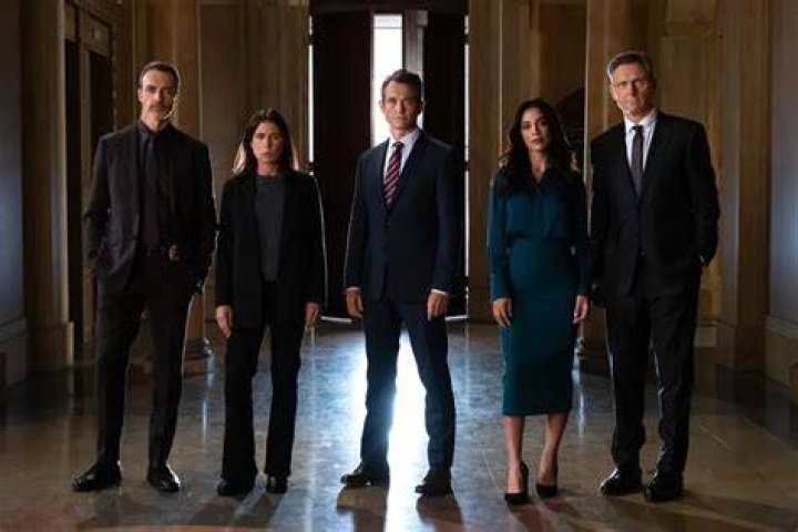 The cast of Law & Order SVU season 25 looks on in a promo image