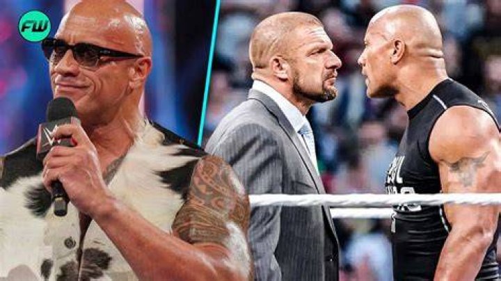 The Rock hitting Triple H with a predigree on the table