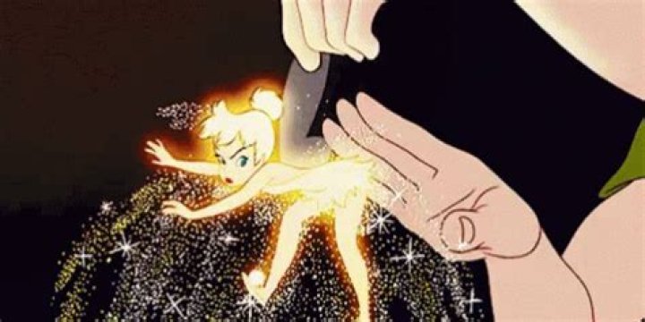 Tinker Bell being shaken for pixie dust by Peter Pan