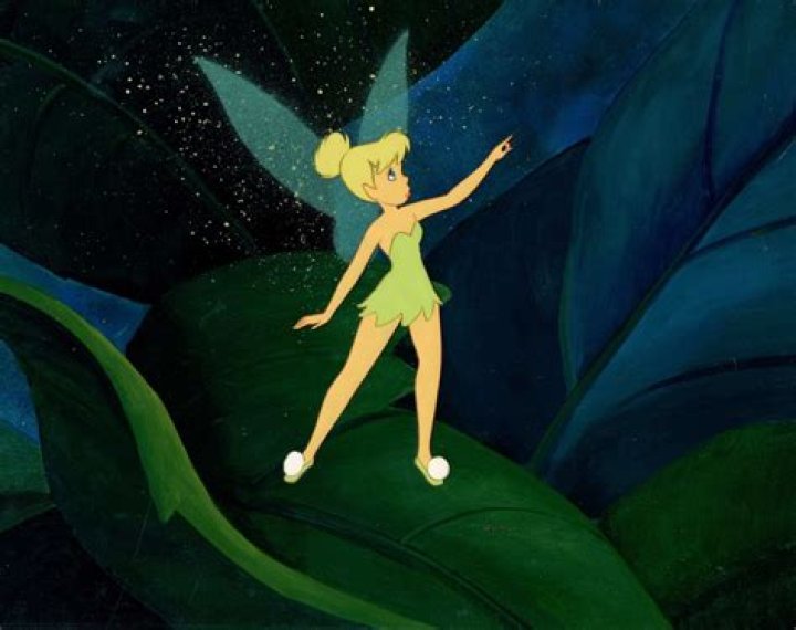 Tinker Bell from Peter Pan in 1953 and her body model Margaret Kelly with an over sized keyhole prop