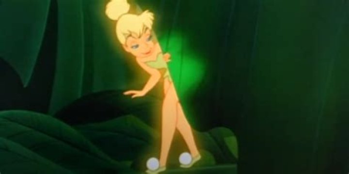 Tinker Bell peering out from behind a leaf in Peter Pan (1953)