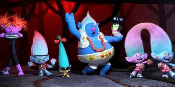 Trolls lined up dancing in Trolls World Tour.