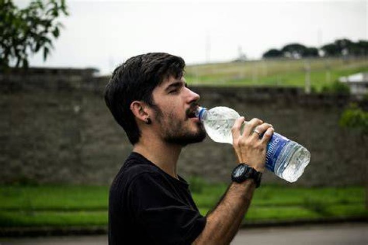 Video of Man Drinking Booze from His Shoe Grosses Mzansi Out: “Someone’s Pillar of Strength”