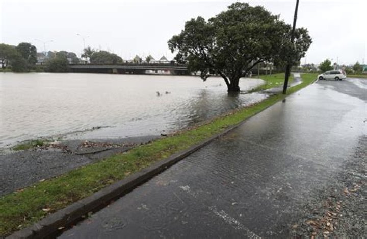 Water creeps along Riverside carpark in Whangārei as a king tide rises. Photo / Michael Cunningham