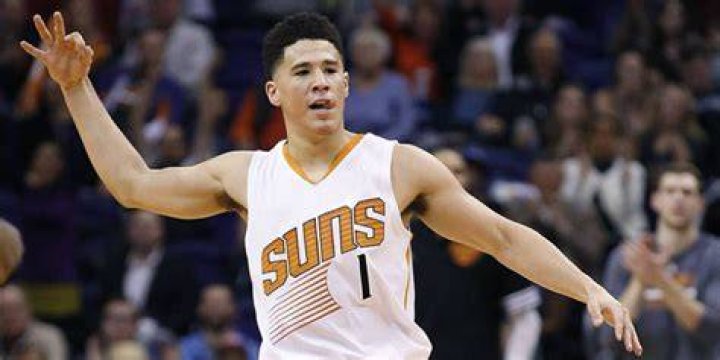 What race is Devin Booker's parents?