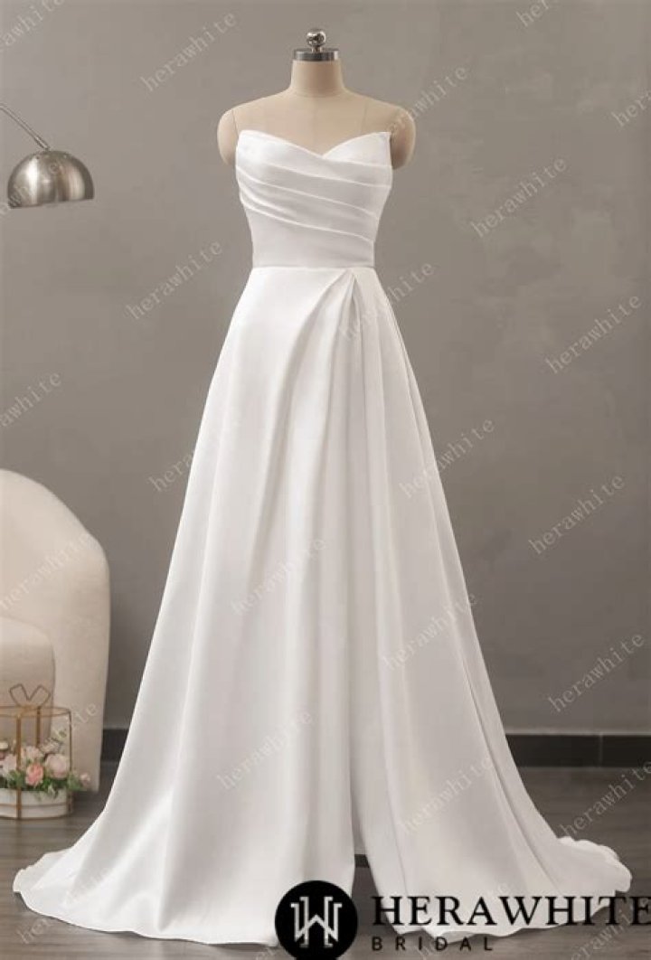 White A-line gown with pleats and a halter mock neck