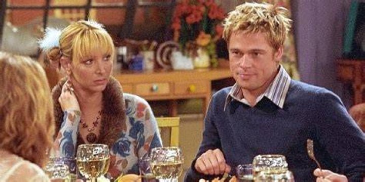 Will Colbert and Phoebe Buffay sitting across the table from Rachel at Monica's on Friends.